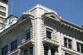 Top floor corner of Clift Building with pedimented protruding windows. Salt Lake City, UT.