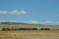 Small freight train running along Highway US6 / US191 West of Green River, Utah. UT.