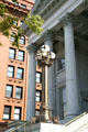 Portico of U.S. Customhouse with lamp, one of last government buildings modeled after Roman Temples. Norfolk, VA.