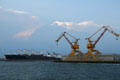 Yellow cranes & container ships n Norfolk Harbor. Norfolk, VA.