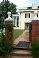Garden gate with Oatlands mansion which has semi-octagonal ends. Leesburg, VA.