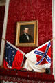 Jefferson Davis portrait over parlor fireplace with southern flags in White House of the Confederacy. Richmond, VA