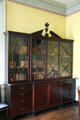 Bookcase with swan neck pediment in large dining room of John Marshall House. Richmond, VA.