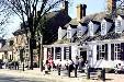 Raleigh Tavern with brick Unicorn's Horn & John Carter's store in distance in Colonial Williamsburg. Williamsburg, VA.