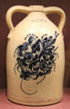 Stoneware jug painted with bouquet by E&LP Norton & Co. of Bennington, VT at Bennington Museum. Bennington, VT.