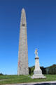 Revolutionary War hero Col. Seth Warner statue before Bennington Monument. Bennington, VT