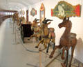 Carousel animals & signs in circus building at Shelburne Museum. Shelburne, VT.