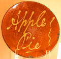 Redware plate trailed slip decorated stating "Apple Pie" at Shelburne Museum. Shelburne, VT.