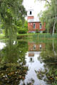 Meeting house reflected in pond at Shelburne Museum. Shelburne, VT.