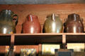 Stoneware jugs with spouts from Bennington, VT in General Store at Shelburne Museum. Shelburne, VT.