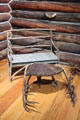 Rustic bench & footstool supported by antlers in Beach Lodge at Shelburne Museum. Shelburne, VT.