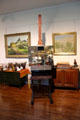 Ogden M. Pleissner's easel, brushes & artwork in studio in Pleissner Gallery at Shelburne Museum. Shelburne, VT.