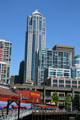 Washington Mutual Tower over waterfront residential buildings & Miner's Landing pier. Seattle, WA.