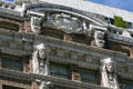 Cornice with sculpted Indians on Cobb Building. Seattle, WA.