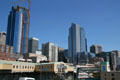 Skyline of Seattle with Pike Place Market buildings strung along escarpment edge. Seattle, WA.