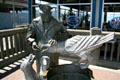 Statue of Ivar Feeding Gulls outside seafood fish bar he started. Seattle, WA.
