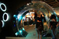 Visitors walk through jellyfish tank at Seattle Aquarium. Seattle, WA.