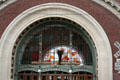 Arched windows of Tacoma Union Station with Dale Chihuly glass sculptures. Tacoma, WA.