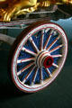 Red, white & blue wooden wheel of circus bandwagon at Circus World Museum. Baraboo, WI.