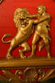 Lion tamer carving detail on red & gold lion tamer circus wagon at Circus World Museum. Baraboo, WI.
