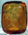 Amber paperweight with profile of Abraham Lincoln at Fostoria Glass Museum. Moundsville, WV.