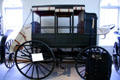 U.S. Army Dougherty wagon by Kansas Manuf. Co., Leavenworth, KS, with seats which folded flat to make ambulance at Cheyenne Frontier Days Old West Museum. Cheyenne, WY.