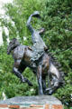 Sculpture of Cowboy on bucking bronco by Bud Boller in Jackson town park. Jackson, WY.