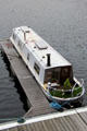 Canal boat docked at Royal Albert Docks. Liverpool, England.