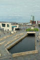 Pier Head area around Leeds canal extension, Mersey Ferries terminal, cruise ship docks beyond. Liverpool, England.