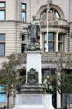 Memorial of Sir Alfred Lewis Jones noted for African colonial shipping under a statue of personification of Liverpool by George Frampton at Pier Head. Liverpool, England.