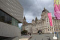 Three Graces of Pier Head face modern Museum of Liverpool. Liverpool, England.