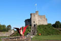 Castle Keep with red dragon, symbol of Wales, in foreground at Cardiff Castle. Cardiff, Wales.