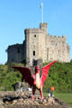 Castle Keep with red dragon, symbol of Wales, in foreground at Cardiff Castle. Cardiff, Wales.