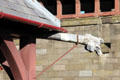 Drainage downspout capped with head of fowl at Cardiff Castle. Cardiff, Wales.