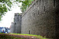 Reconstructed Roman Wall with glimpse of town in background beyond at Cardiff Castle. Cardiff, Wales.