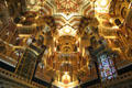 Islamic style, gilded ceiling with stained glass window insets in Arab Room at Cardiff Castle. Cardiff, Wales.