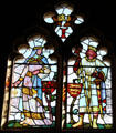 Stained glass windows, designed by William Burges, in Banqueting Hall at Cardiff Castle. Cardiff, Wales.