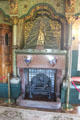 Fireplace & chimneypiece with statue of St John the Baptist, reflecting religious theme of room decorations in Lord Bute's bedroom at Cardiff Castle. Cardiff, Wales.