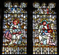 Stained glass windows with Evangelists Mark with lion & Luke with bull at Cardiff Castle. Cardiff, Wales.