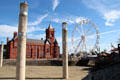 View of Pierhead building & Ferris wheel from water front at Cardiff Bay. Cardiff, Wales