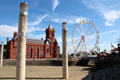 View of Pierhead building & Ferris wheel from water front at Cardiff Bay. Cardiff, Wales.