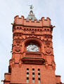 Clock face, finial & gargoyles on the Pierhead building at Cardiff Bay. Cardiff, Wales