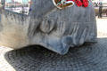 Hull of wrecked ship evolves into face of drowned sailor on Merchant Seafarers War Memorial at Cardiff Bay. Cardiff, Wales.