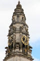 Detail of highest section of clock tower with gilded dials on Cardiff City Hall. Cardiff, Wales