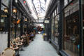 Shops & restaurants in glass roofed Castle Arcade building in City Centre. Cardiff, Wales.