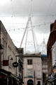 Sail-like structural support of Principality Stadium viewed from pedestrian mall in Cardiff City Centre. Cardiff, Wales.