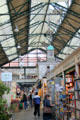 Shoppers in glassed roofed Cardiff Market in Cardiff City Centre. Cardiff, Wales.