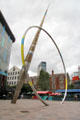 Alliance sculpture, where hoop contains liquid which rises & falls with movement of the tide, by Jean-Bernard Metais on Hayes Place in Cardiff City Centre. Cardiff, Wales.