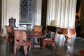 Table & heavy carved chairs made in pseudo medieval style at Penrhyn Castle. Bangor, Wales.
