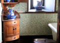 Bathroom, with William Morris wall paper, called Willow Bough serving the Keep Bedrooms at Penrhyn Castle. Bangor, Wales.
